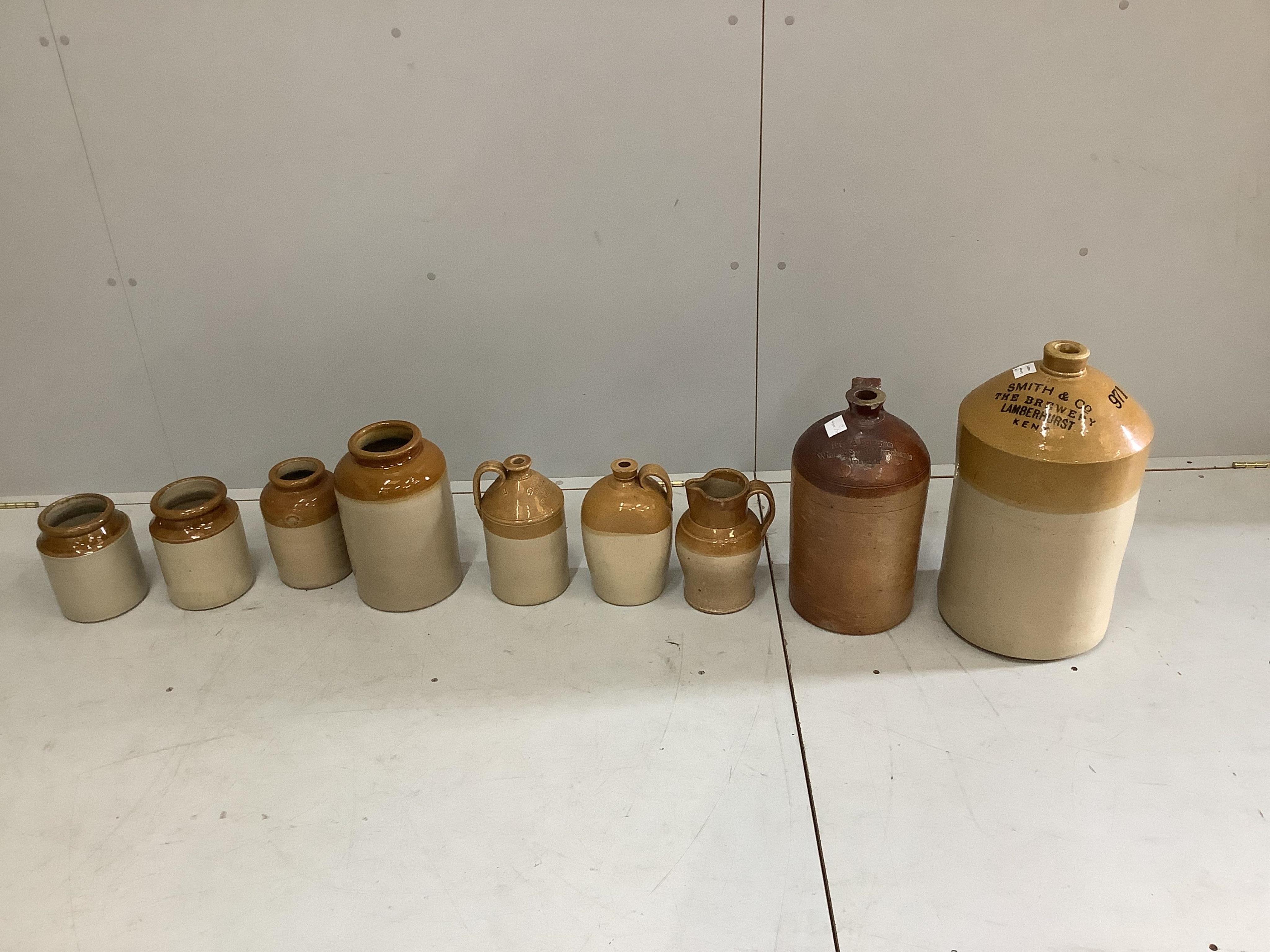 Nine earthenware flagons, largest height 48cm. Condition - fair